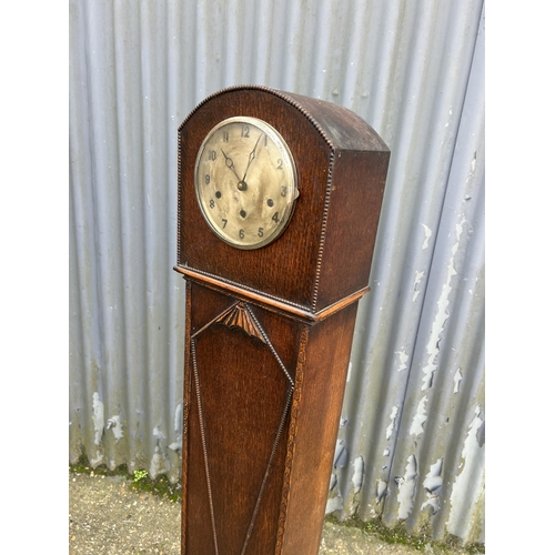 148 - A oak cased grandmother clock