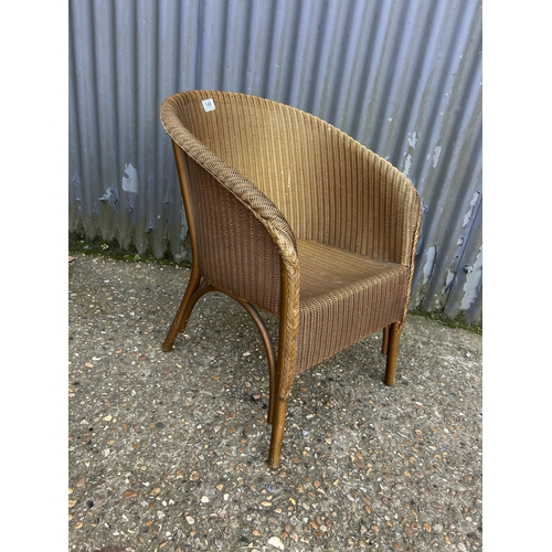 149 - A gold Lloyd loom bedroom chair