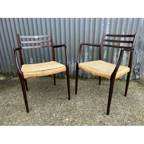 153 - A pair of danish or similar carver chairs with rush seats