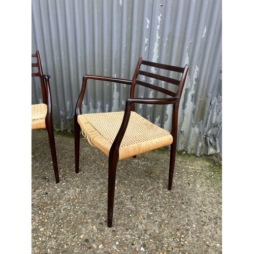 153 - A pair of danish or similar carver chairs with rush seats