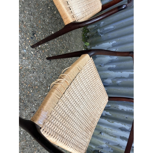 153 - A pair of danish or similar carver chairs with rush seats