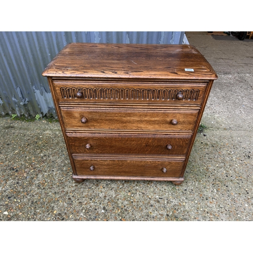 200 - A oak linenfold chest of four 80cm wide