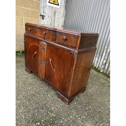 27 - Three drawer 20th century oak sideboard