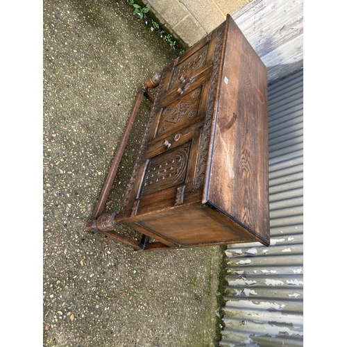 28 - A carved oak three door sideboard 120x45x90