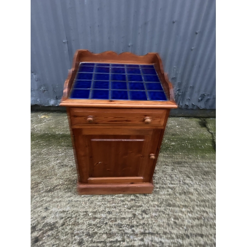 49 - A pine tiled top laundry cupboard 62x58x94