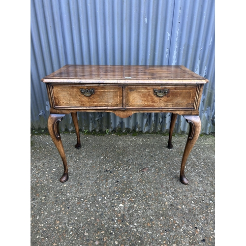 66 - A Georgian walnut two drawer writing table 100x50x80