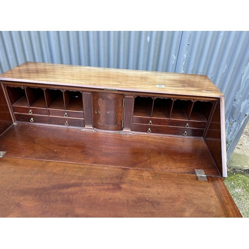 68 - A Victorian mahogany   bureau with fitted interior (missing handle in office) 107x50x110