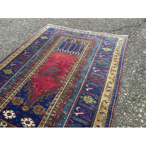 80 - A red and gold pattern oriental rug 190x100