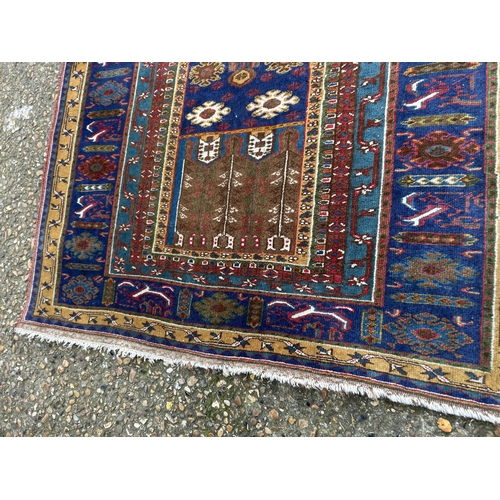 80 - A red and gold pattern oriental rug 190x100