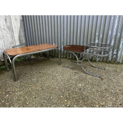 89 - A mid century chrome and smoked glass telephone seat together with a chrome framed coffee table