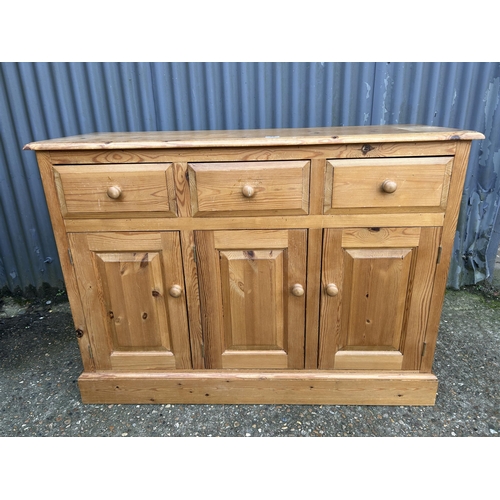 95 - A solid pine three drawer sideboard 120x45x90