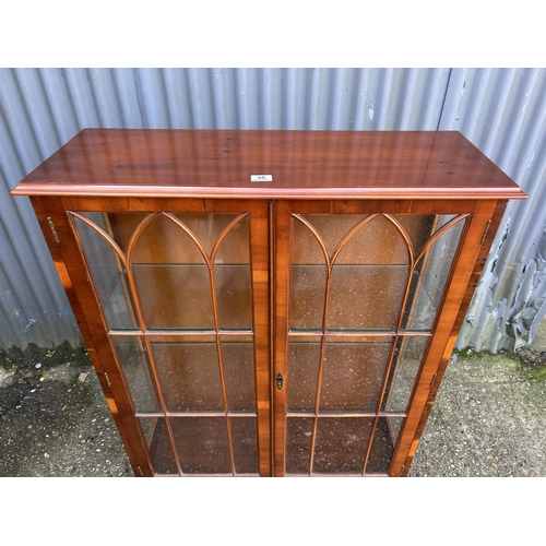 98 - A glazed yew two door display cabinet 93x33x122