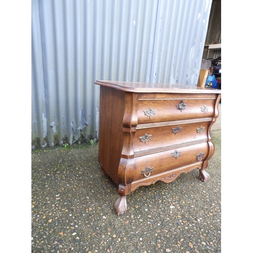 1 - A small oak bombe front cupboard 74 x40x70