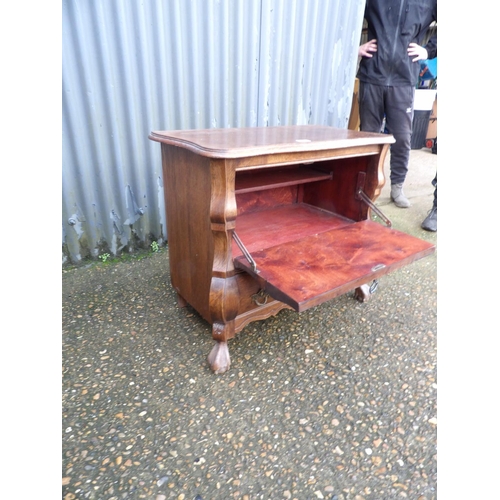 1 - A small oak bombe front cupboard 74 x40x70