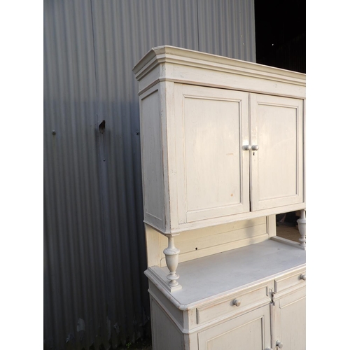 26 - A large grey painted French dresser with two door cupboard top over two drawer and two door base  12... 