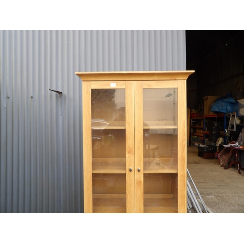 7 - A large modern glazed display cabinet with two drawers 90x48x200