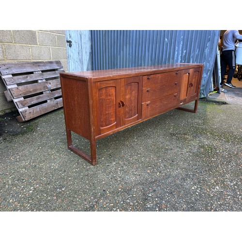 140 - A mid century teak sideboard 214x44x77