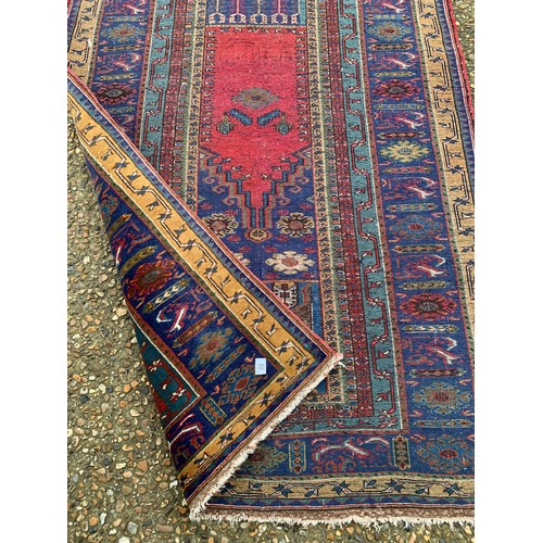 80 - A red and gold pattern oriental rug 190x100