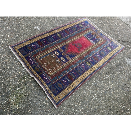 80 - A red and gold pattern oriental rug 190x100