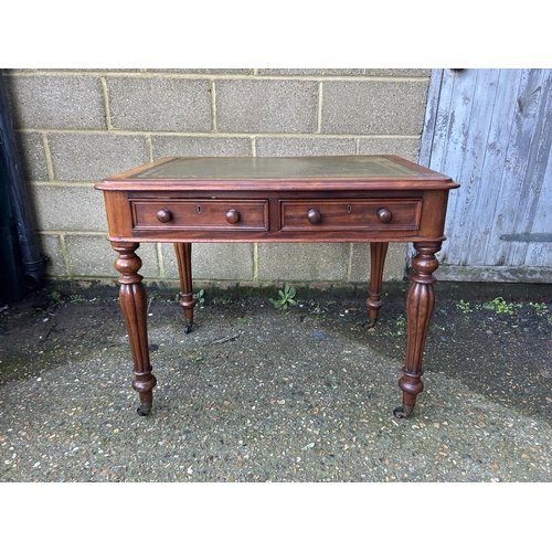 1 - A Victorian mahogany two drawer writing table with green leather top   92x70x74