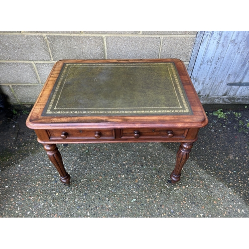 1 - A Victorian mahogany two drawer writing table with green leather top   92x70x74