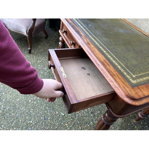 1 - A Victorian mahogany two drawer writing table with green leather top   92x70x74