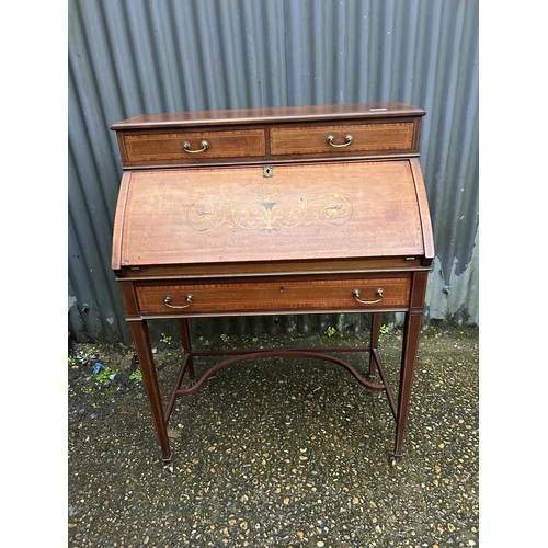 167 - An Edwardian inlaid bureau desk 78cm wide