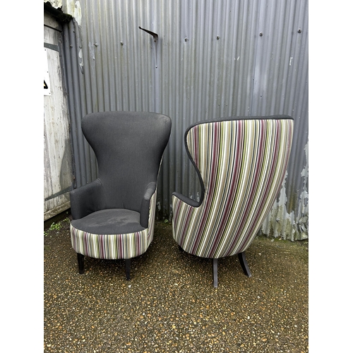 183 - A pair of modern black and striped wing back armchairs