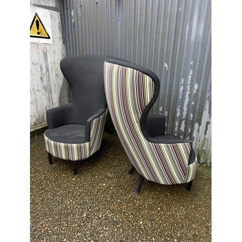 183 - A pair of modern black and striped wing back armchairs