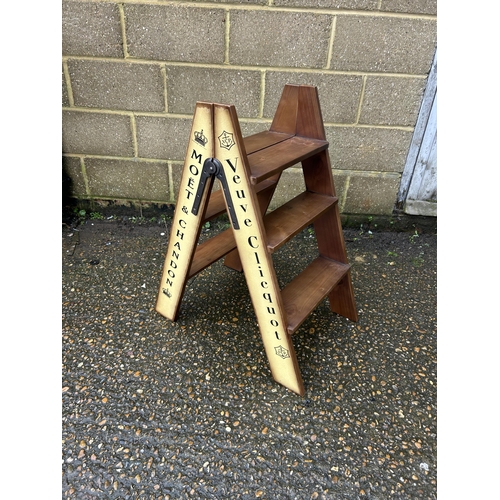 196 - A pair of wooden wine cellar steps painted yellow with Bollinger/Veuve Cliquot