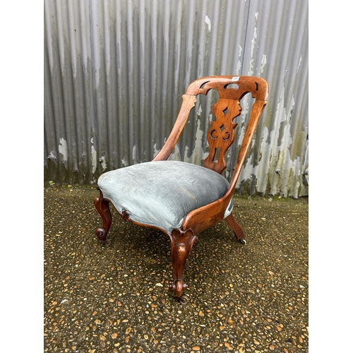 200 - A Victorian mahogany chair with blue upholstered seat