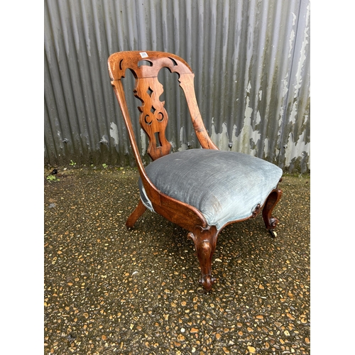 200 - A Victorian mahogany chair with blue upholstered seat