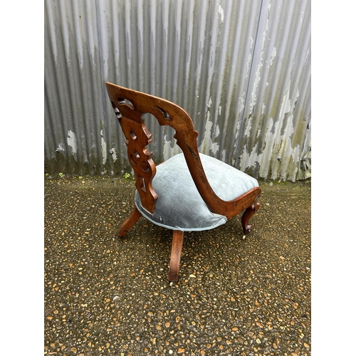 200 - A Victorian mahogany chair with blue upholstered seat