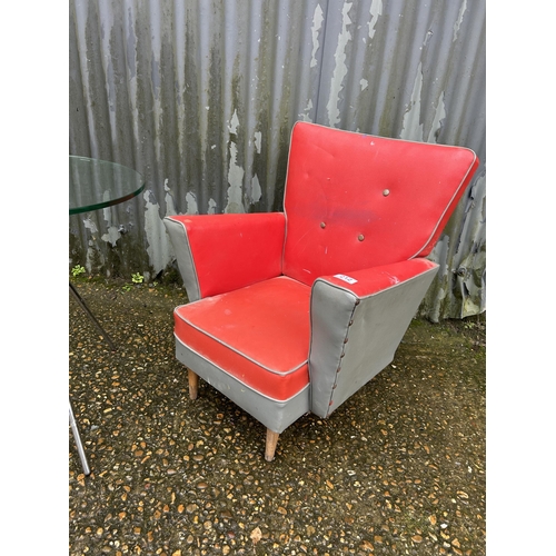 213 - A retro child's armchair together with circular glass top side table