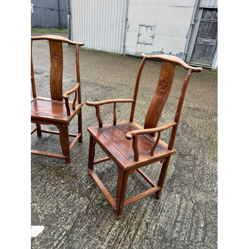 217 - A pair of oriental hardwood carver chairs