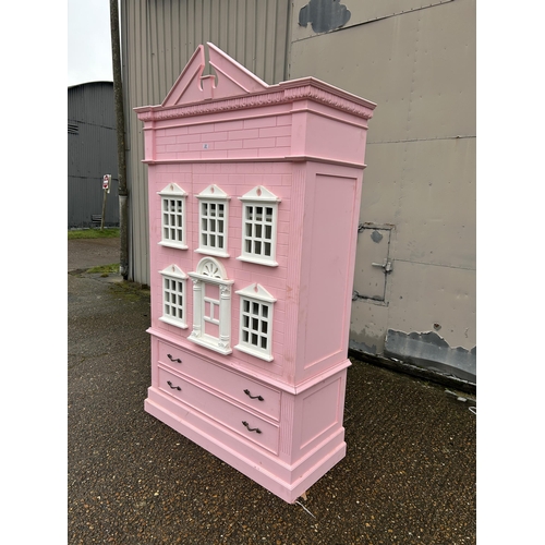 222 - A very large nursery wardrobe styled as a large pink dolls house 125x55x 177