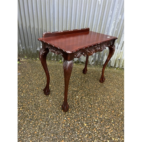 223 - A reproduction mahogany ball and claw side table 92x45 x80