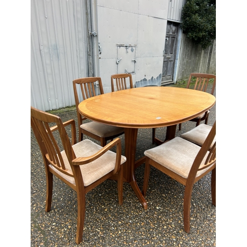 224 - A mid century teak extending dining table and six chairs by tunridge