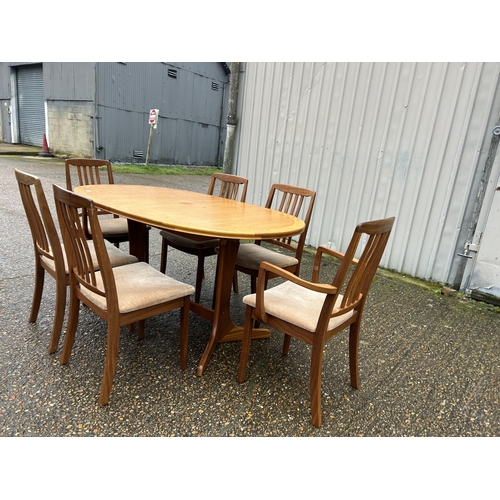 224 - A mid century teak extending dining table and six chairs by tunridge