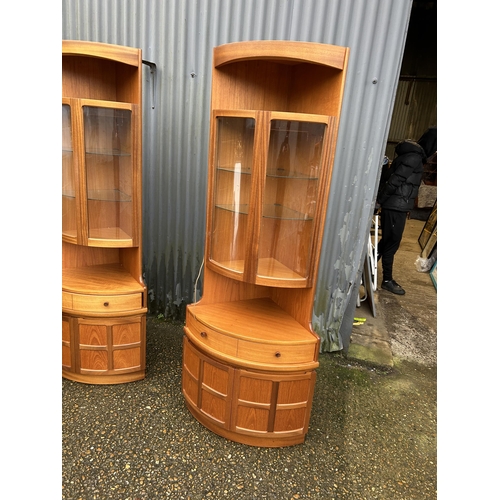 229 - A pair of Nathan teak corner display cabinets