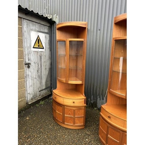 229 - A pair of Nathan teak corner display cabinets