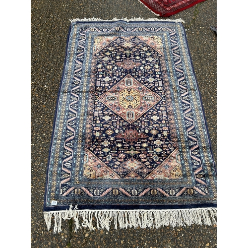 234 - An oriental blue silk rug 130x195