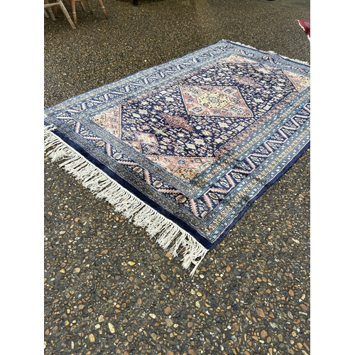 234 - An oriental blue silk rug 130x195