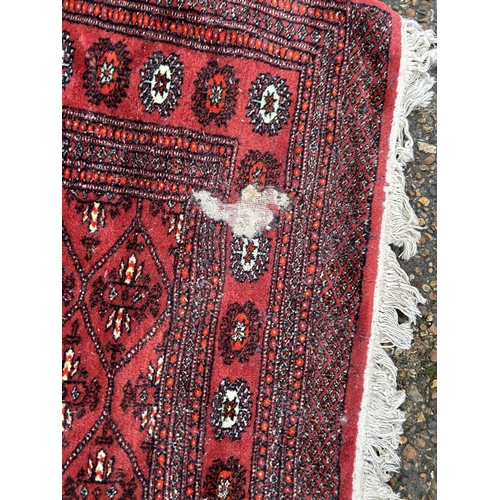 237 - A red and gold pattern rug 130x210