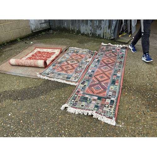 24 - A collection of four modern rugs