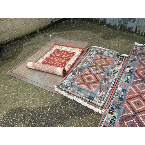 24 - A collection of four modern rugs