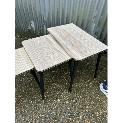 242 - A retro formica nest of three occasional tables