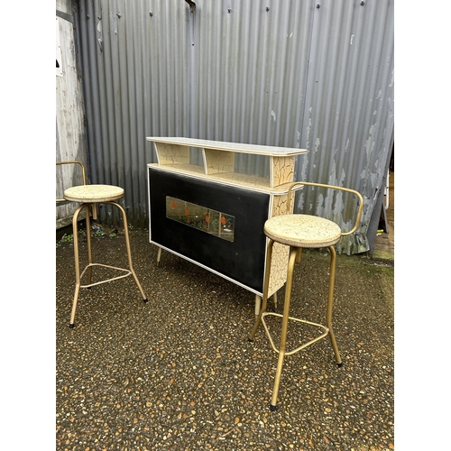 244 - A mid century Formica and vinyl bar together with 2 stools