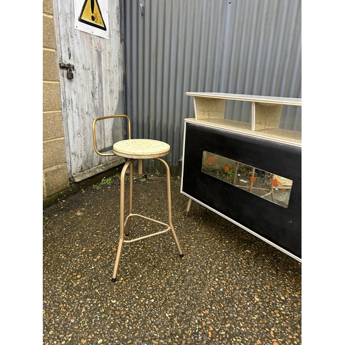 244 - A mid century Formica and vinyl bar together with 2 stools