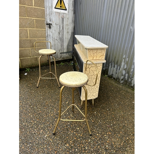 244 - A mid century Formica and vinyl bar together with 2 stools